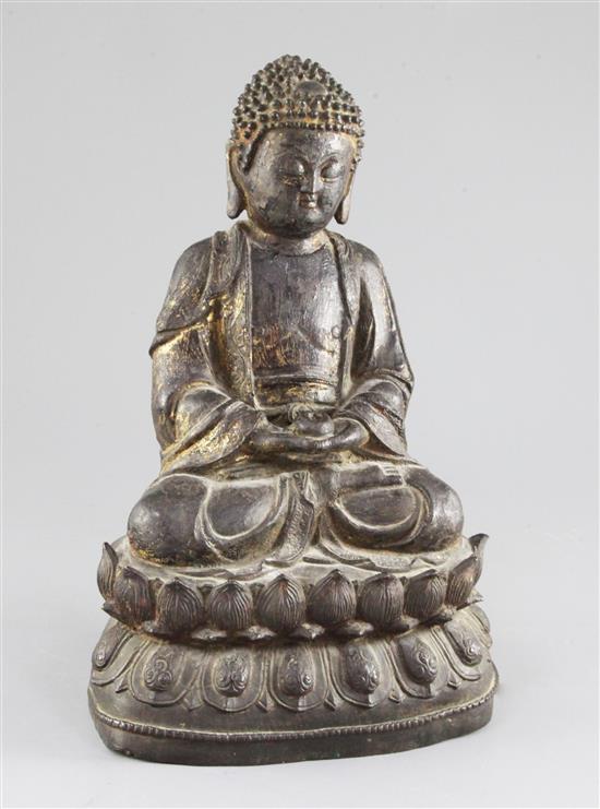 A Chinese gilt-lacquered bronze seated figure of Buddha Shakyamuni, early 17th century, 30cm, By repute purchased from Bluetts